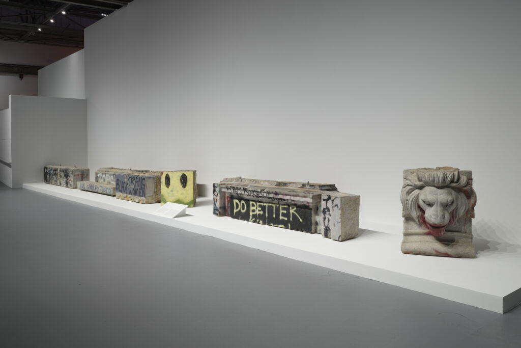 Installation view of slabs of granite that have been graffiti'd